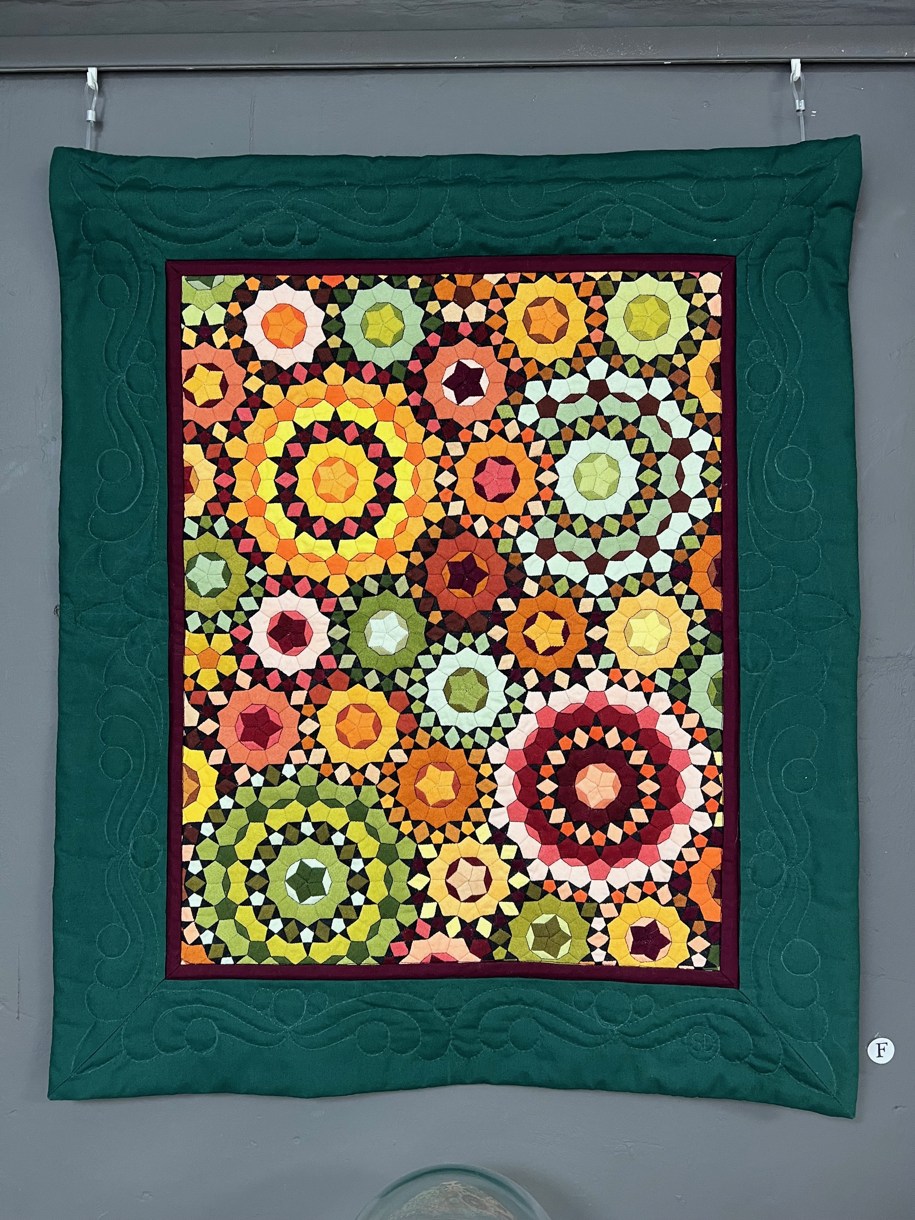 Quilt in Herbstfarben mit Millefiorimuster